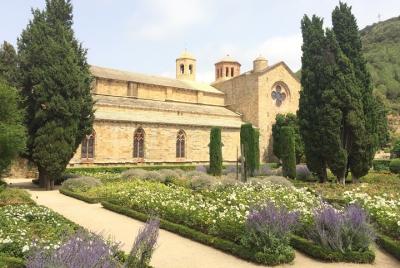 Tour to Lagrasse village & Fontfroide Abbey. Shared tour from Car