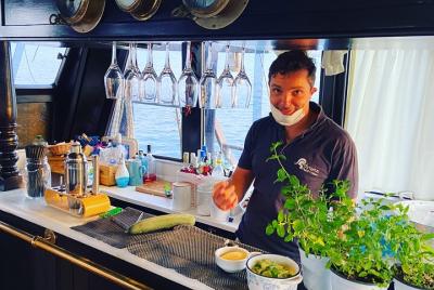 Aperitif at Sunset in a sailing ship in the Gulf of Naples Aperitif at Sunset in a sailing ship in the Gulf of Naples