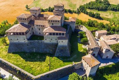  Parmigiano Reggiano, Parma Ham and Torrechiara Castle tour from 