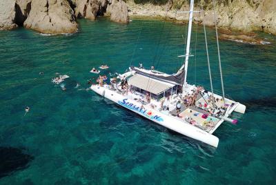 Sailing along the Costa Brava in a big Catamarán with buffet-barb Sailing along the Costa Brava in a big Catamarán with buffet-barb