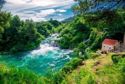 Krka Waterfalls and Sibenik Day Trip Including Wine Tasting from 