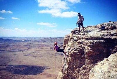 Rappel (abseil) down the cliff of the Ramon Crater Rappel (abseil) down the cliff of the Ramon Crater
