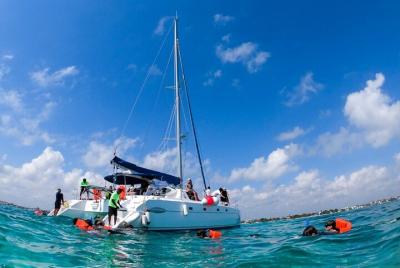 Catamaran sailing away to the Island, Isla Mujeres.
