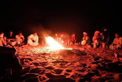 Day and Night by Camels in Erg chebbi Dunes Day and Night by Camels in Erg chebbi Dunes