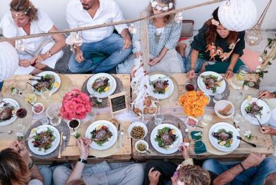 Bohemian dinner party on a beautiful rooftop near the coast